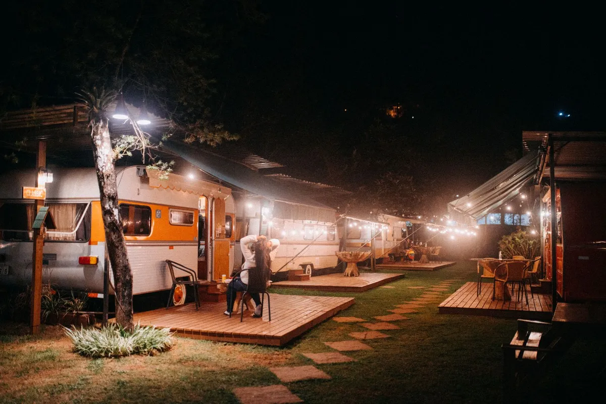 RVs parked at a campground beside a lake